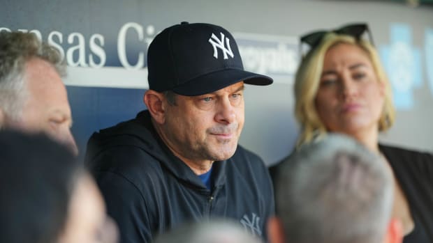 Oct 1, 2023; Kansas City, Missouri, USA; New York Yankees manager Aaron Boone (17) talks with reporters prior to a game against the Kansas City Royals at Kauffman Stadium.